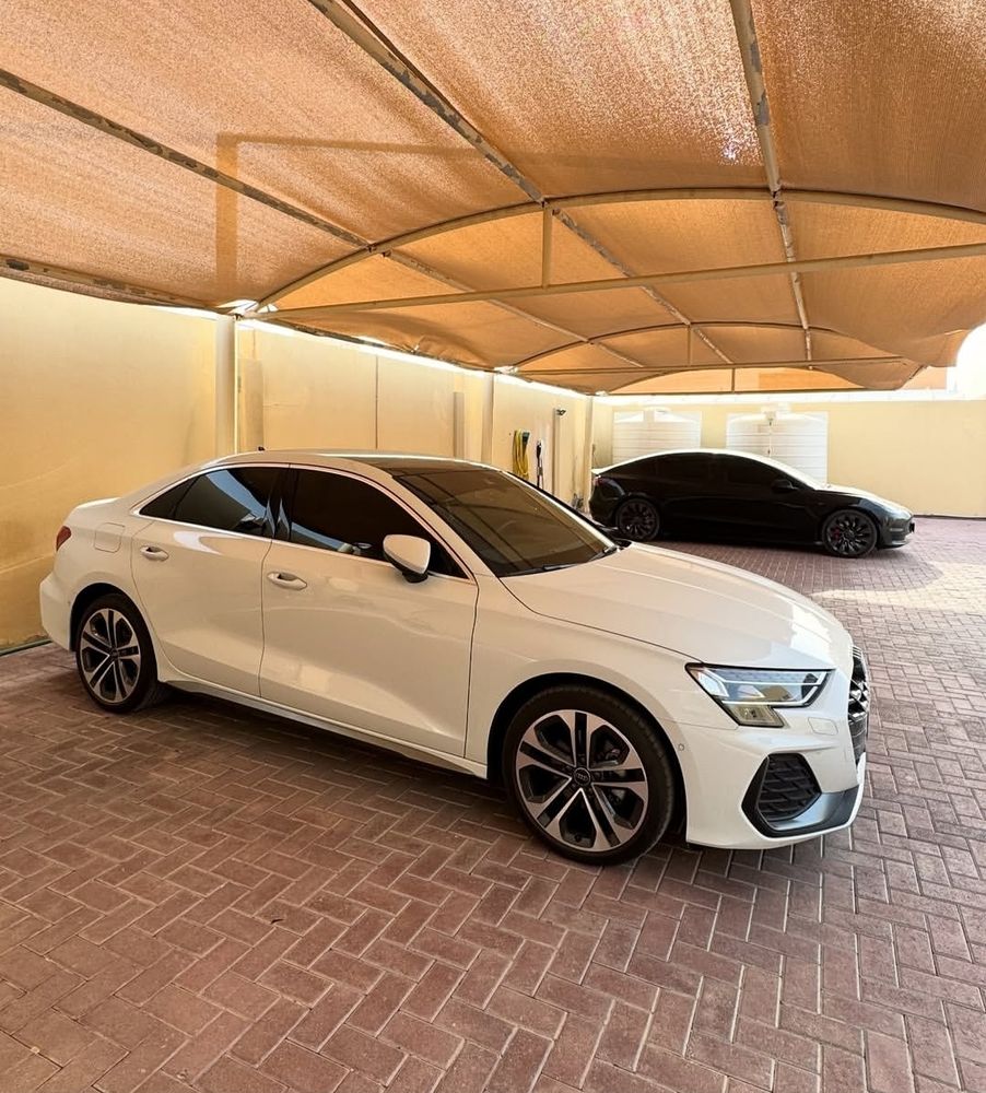 Flawless bubble-free tint finish on a white Audi